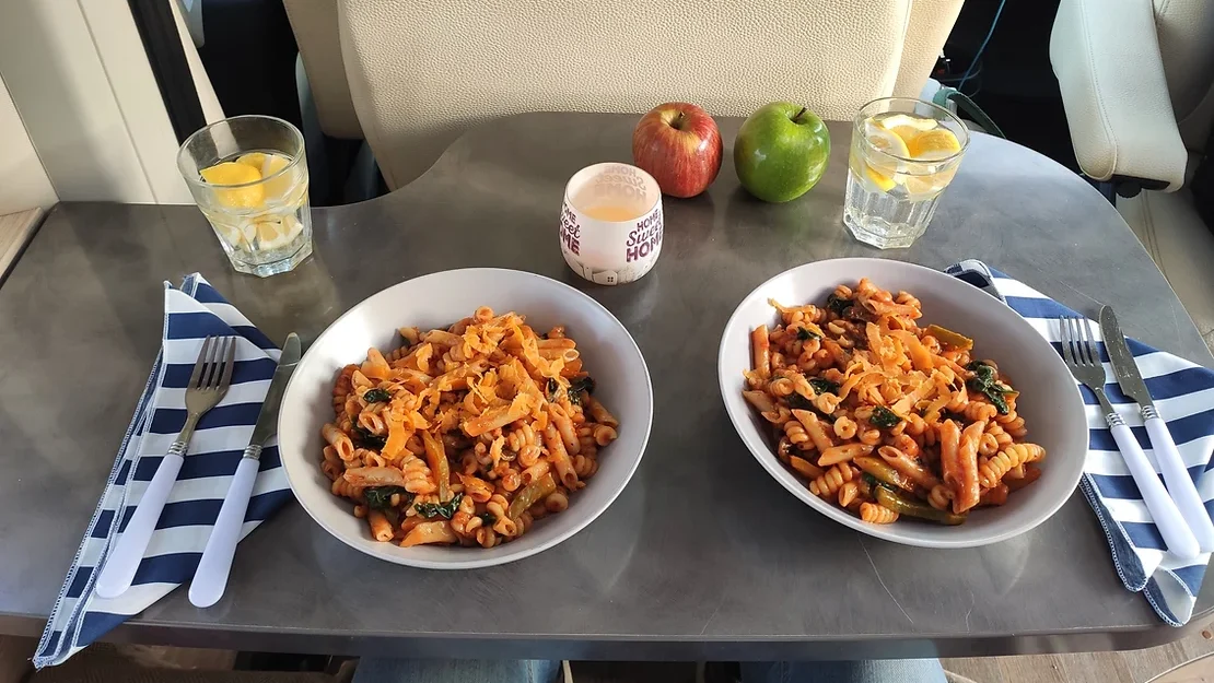 Pasta dishes inside a camper van.