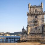 Historic tower in Belem along waterfront.