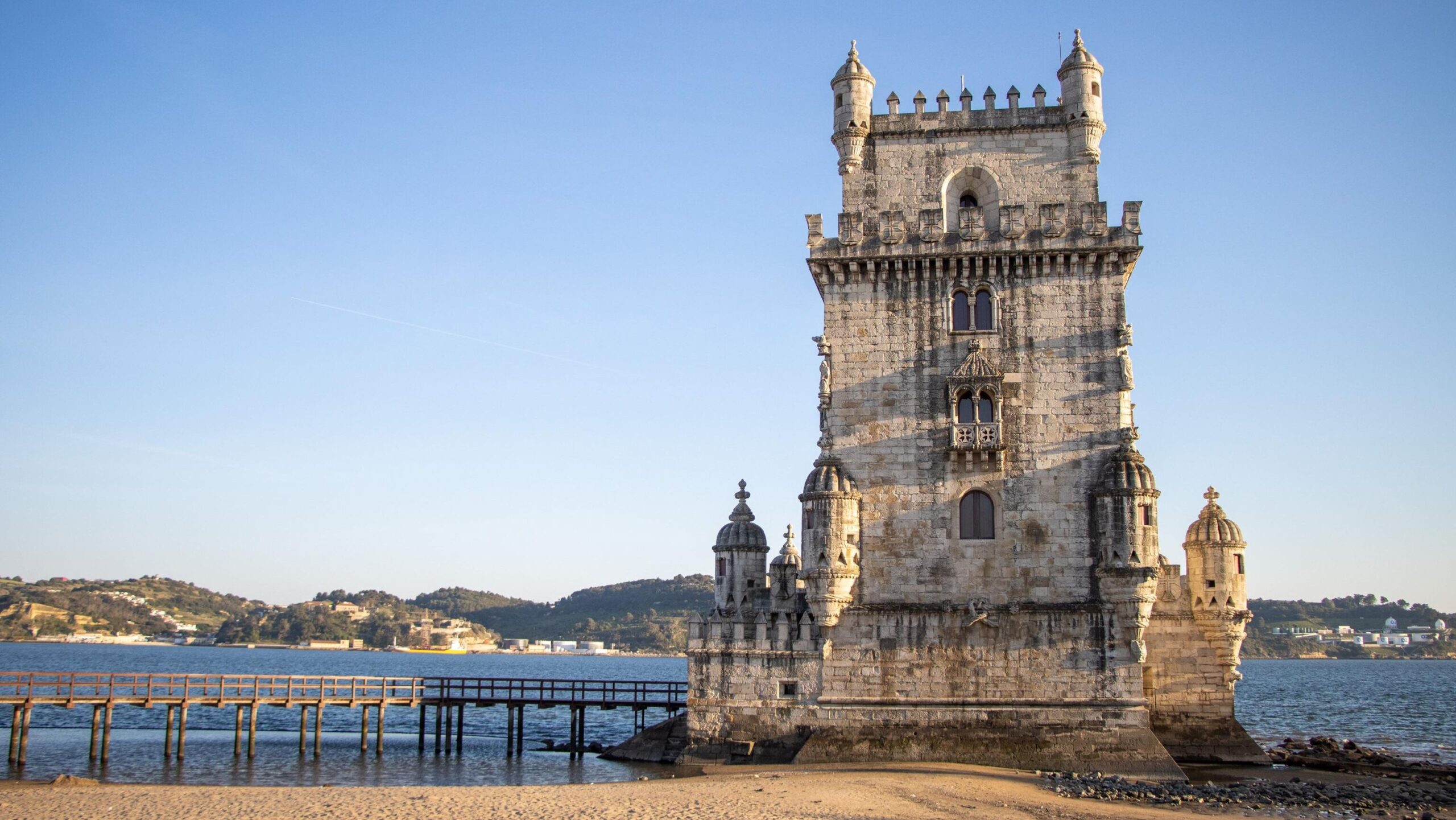 Historic tower in Belem along waterfront.