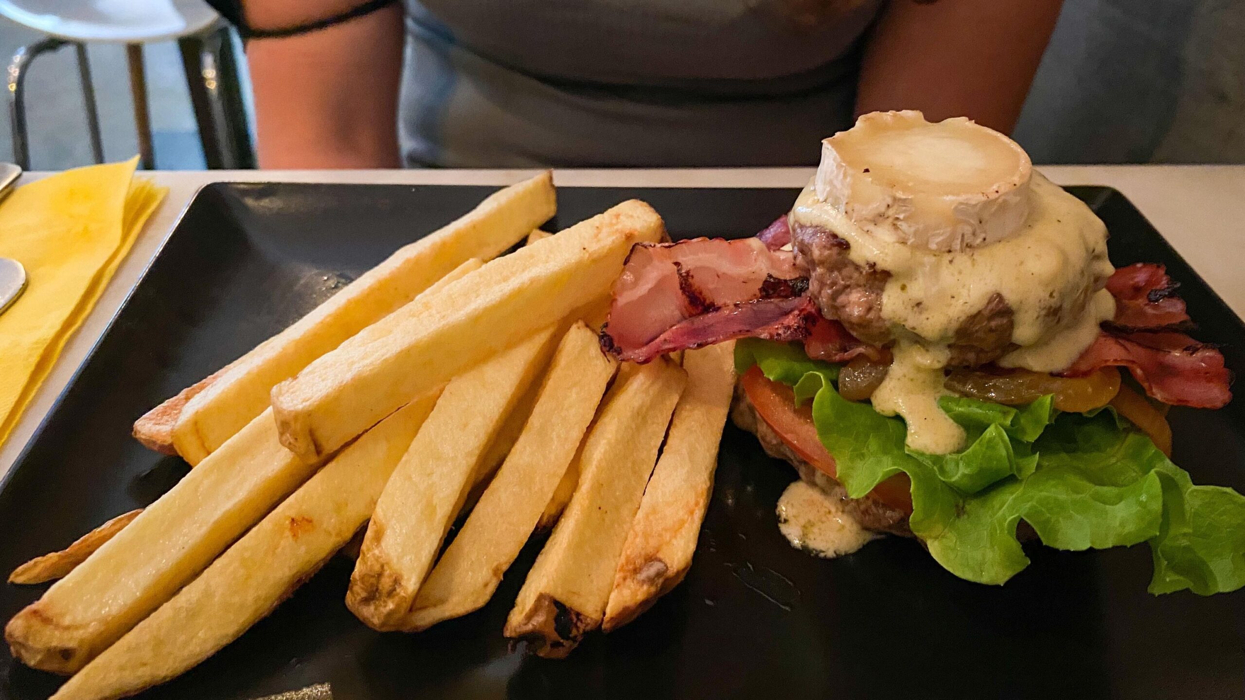 Open faced burger with long fries in Lisbon.