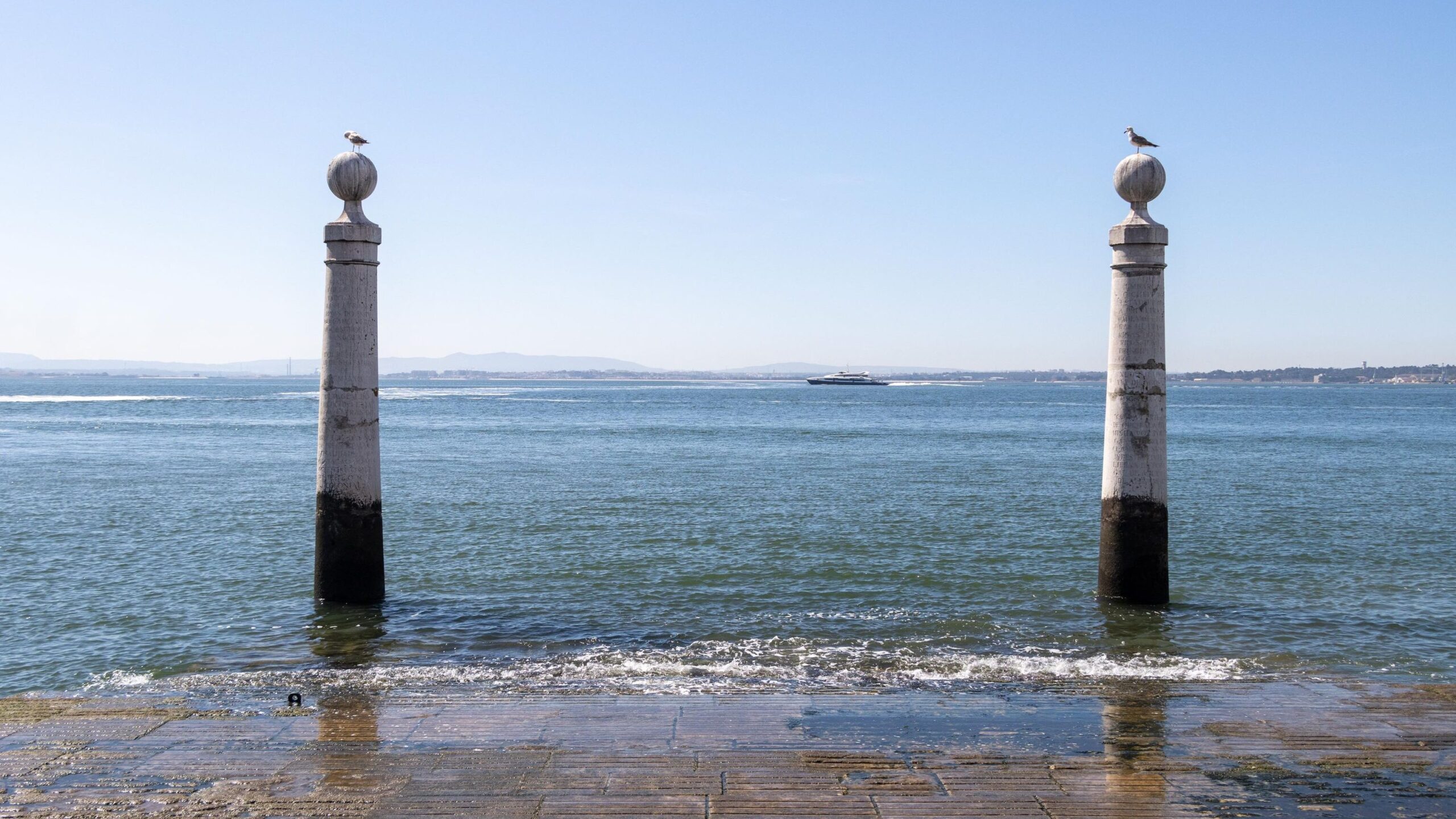 Two pillars in water in Lisbon.