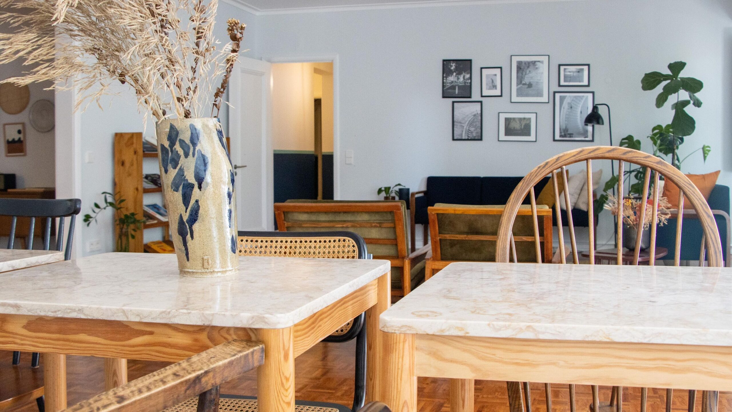 Two tables in living room of hotel.