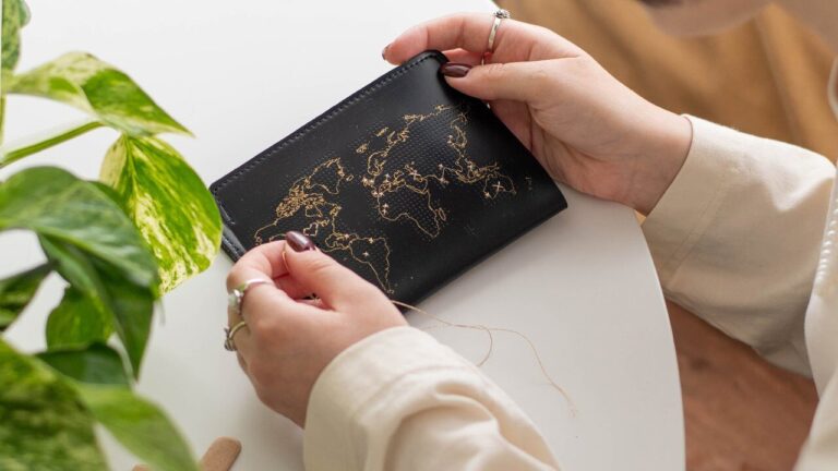 Leather passport cover with map sewn on.