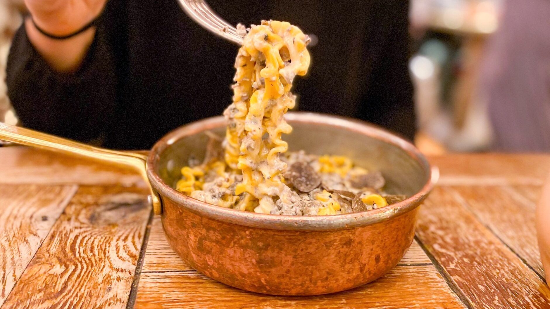 Truffle pasta served in copper pan.