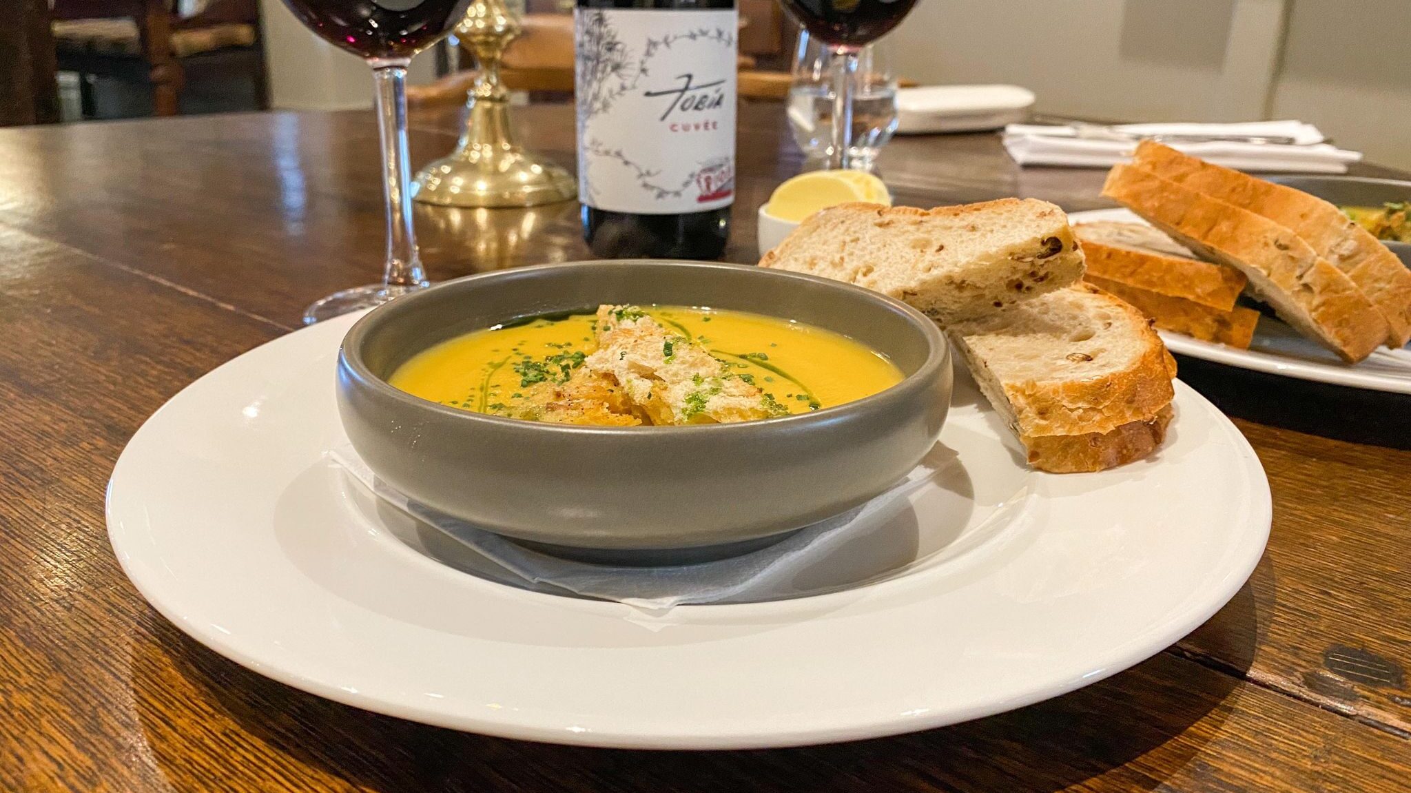 Fresh winter vegetable soup with bread.