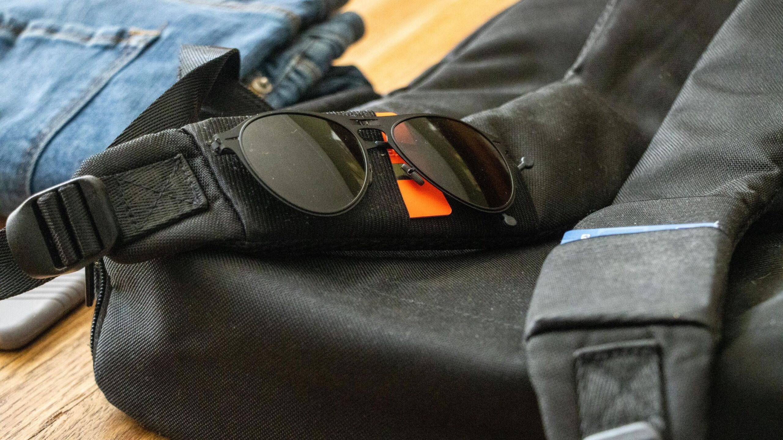 Backpack strap with sunglasses pocket.