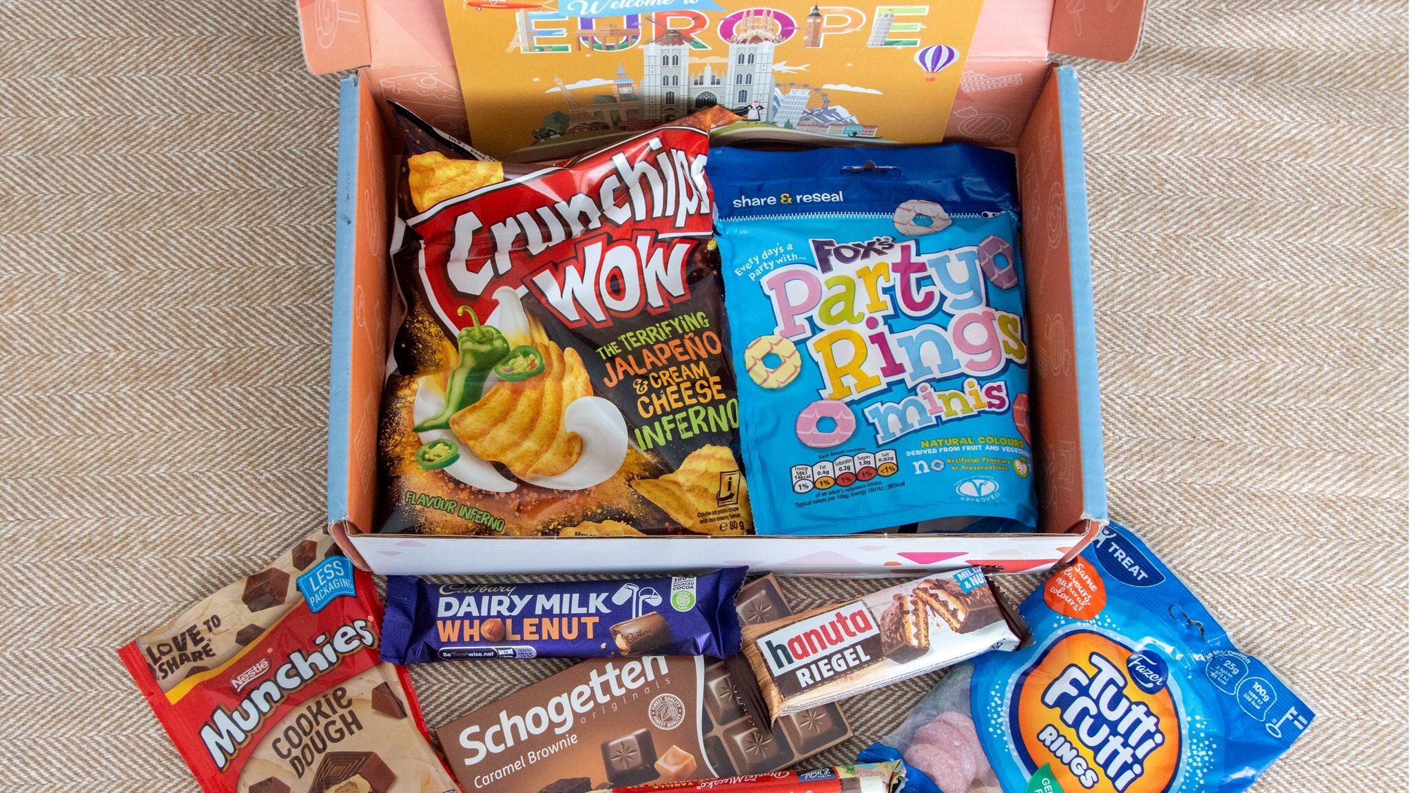 Box filled with crisps and chocolates.