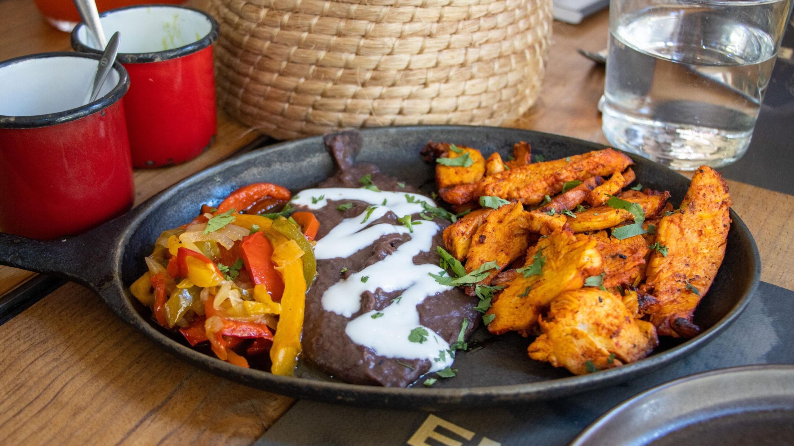 Chicken fajitas on table in Mexican restaurant. 