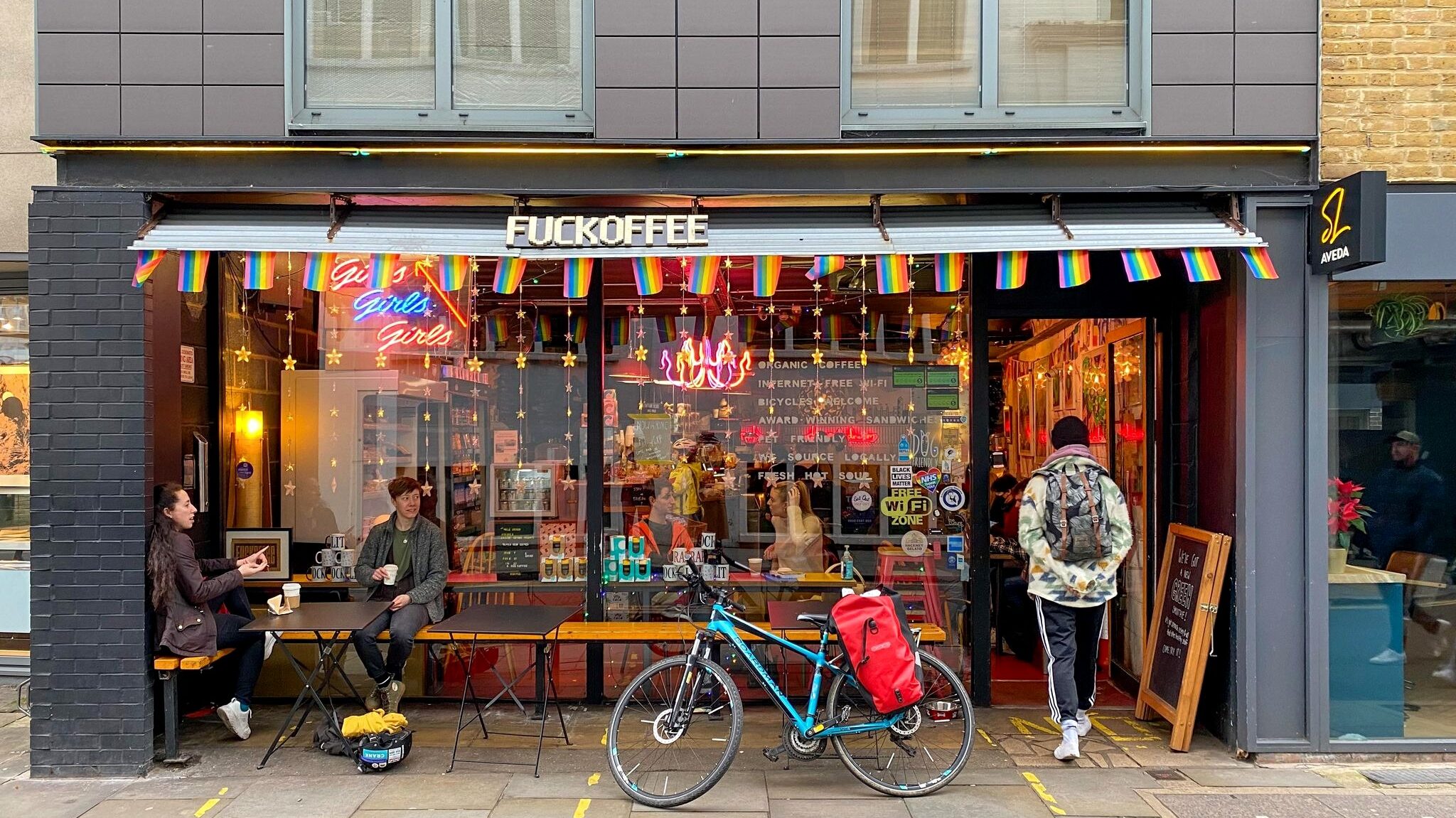 Exterior of coffee shop in pride colours.