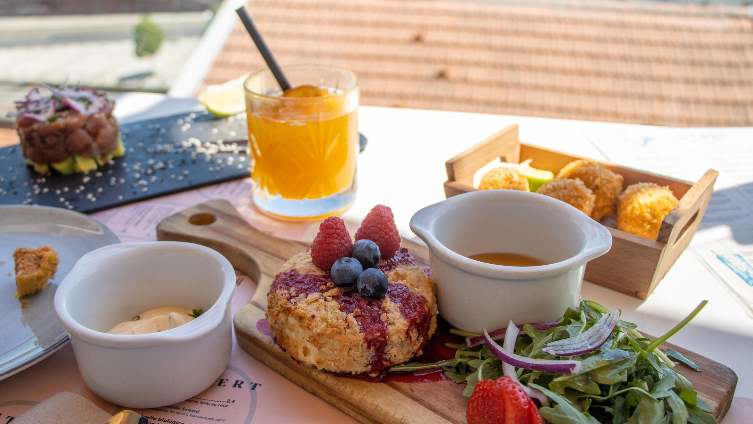 Selection of starters on rooftop restaurant table.