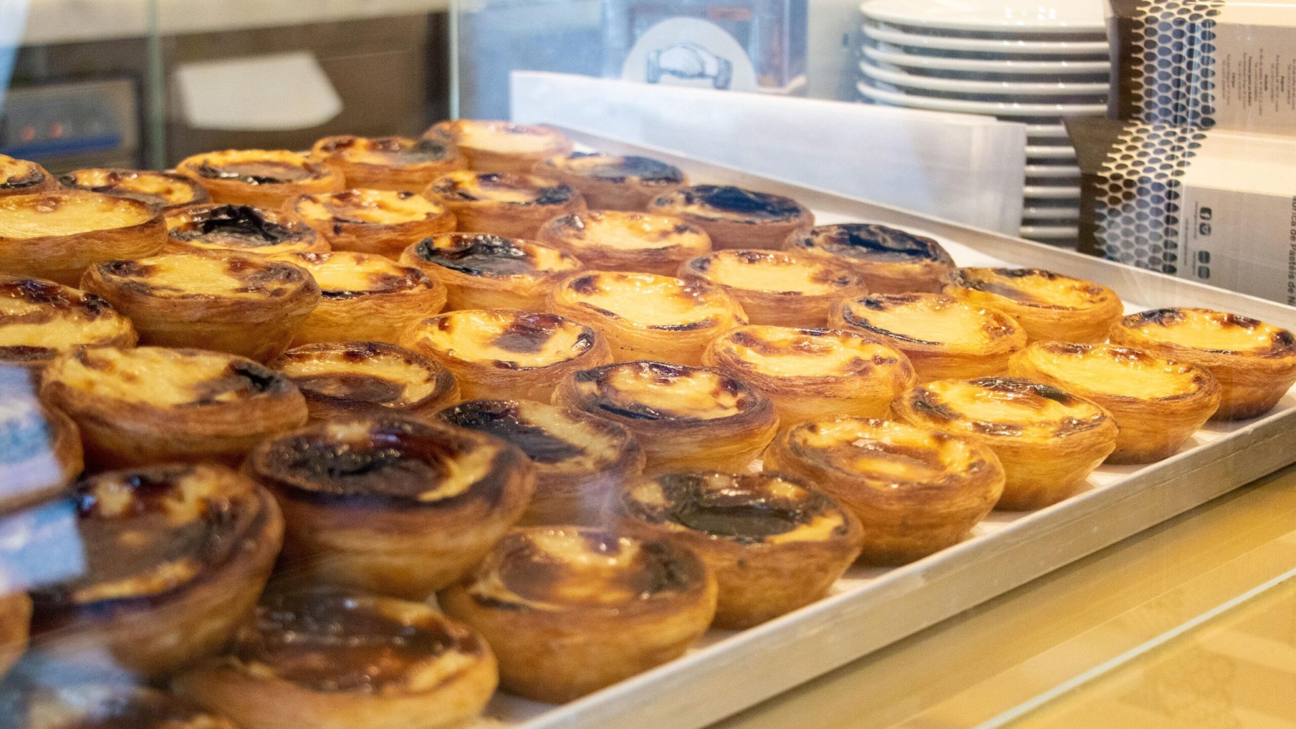 Selection of custard tarts in cafe in Belem.