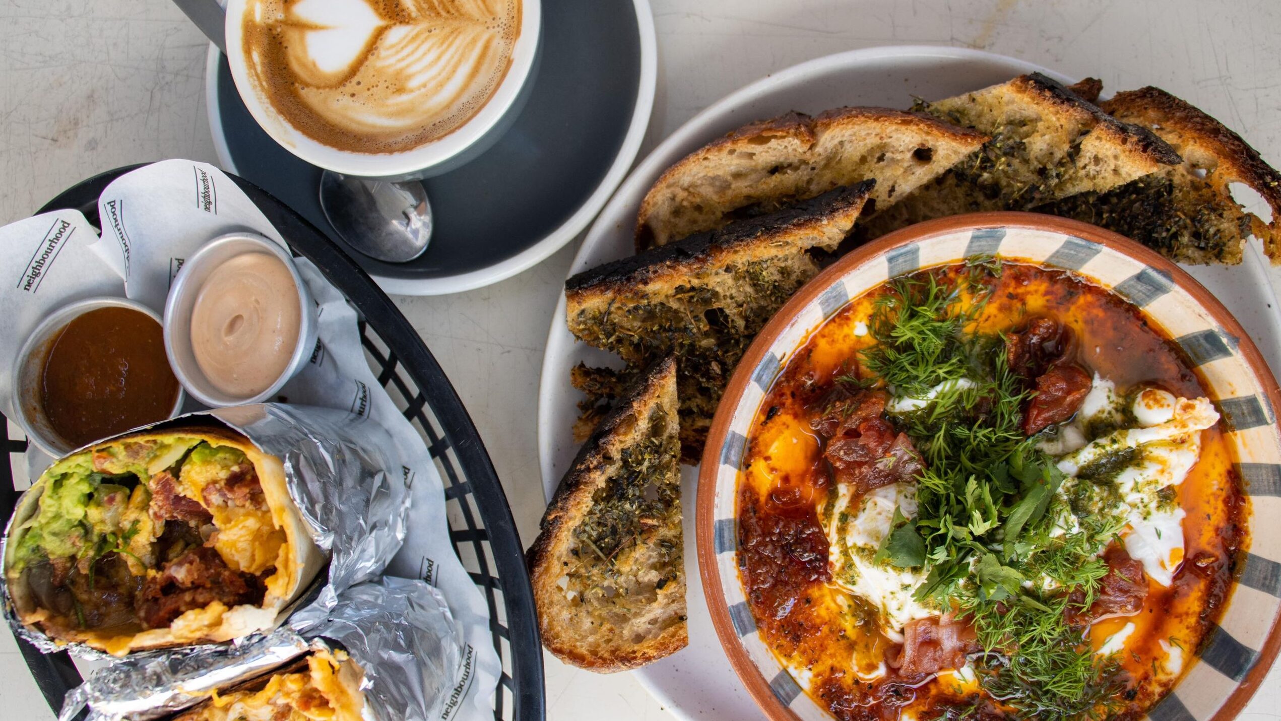 Selection of breakfast food and coffee.