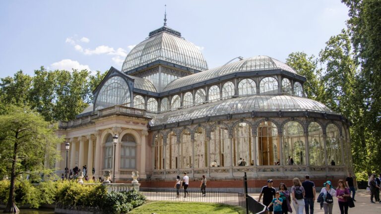 Large glass greenhouse in Retiro Park.