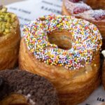 Box full of croissant-doughnuts.