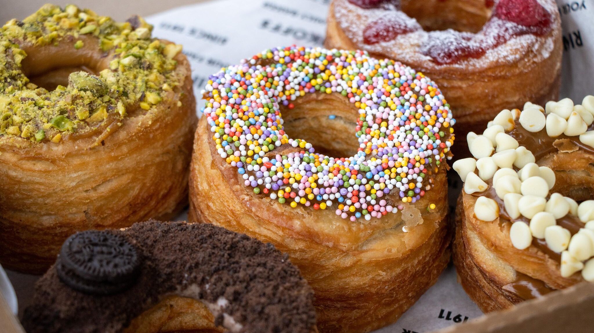 Box full of croissant-doughnuts.