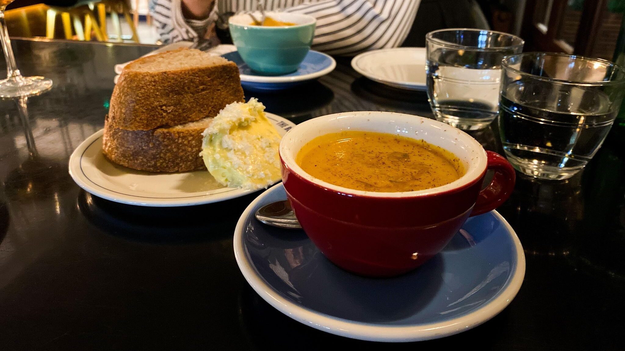 Soup served with large slices of bread.