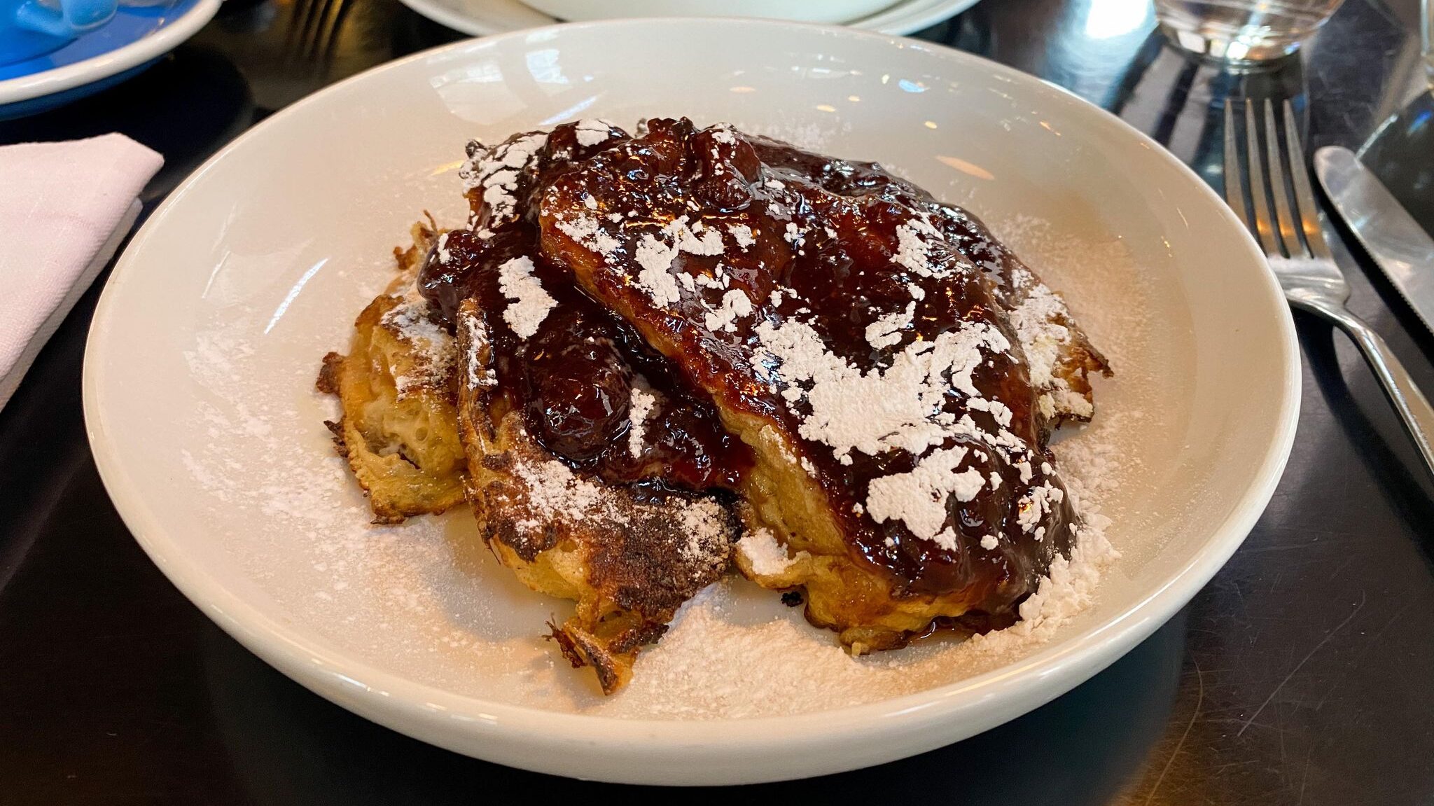 French toast topped with jam and sugar.