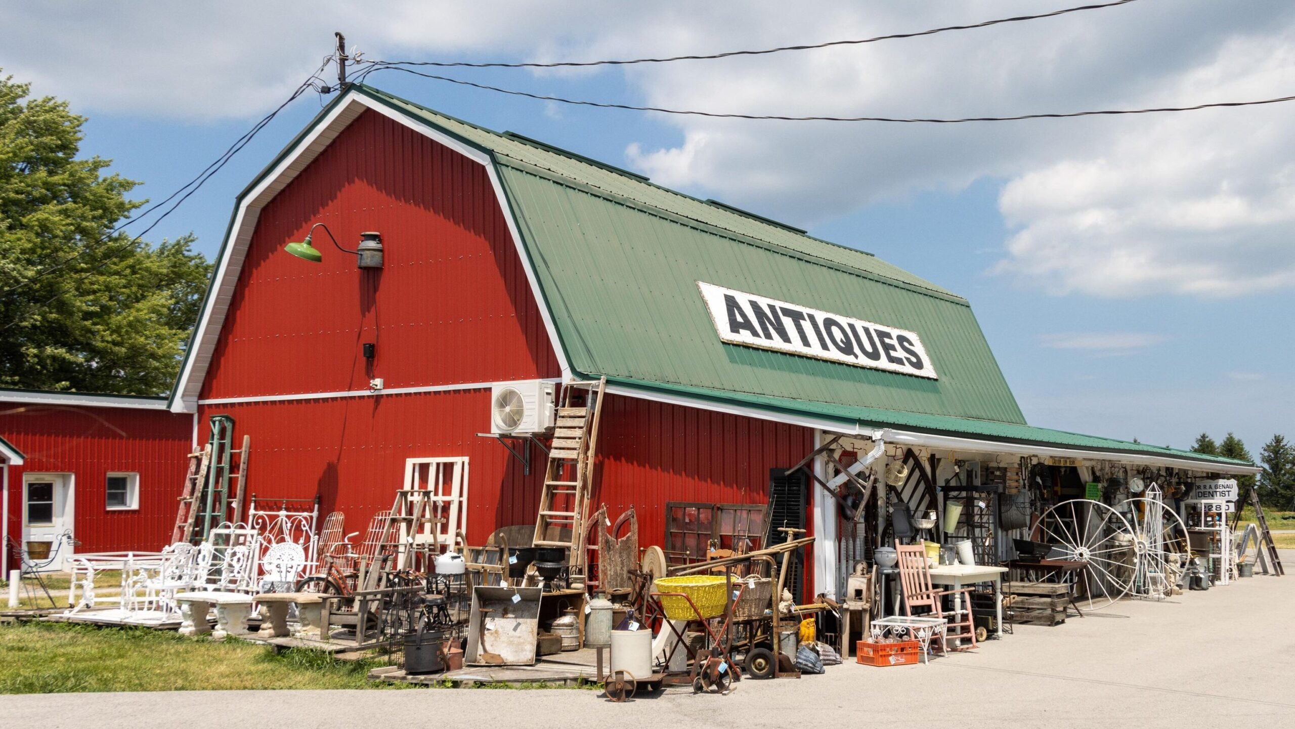 Red painted barn used as antiques shop.