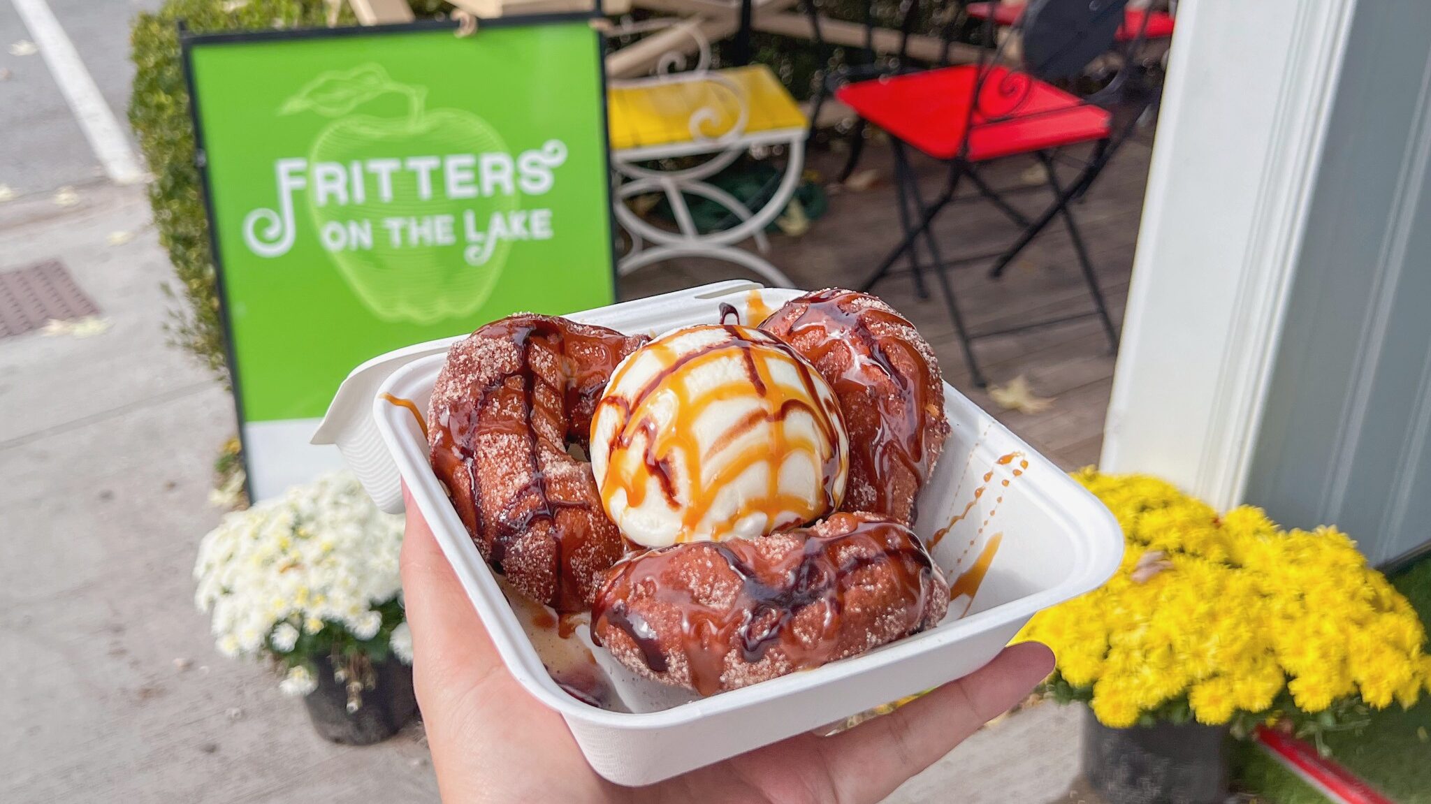 Apple fritters served with ice cream.