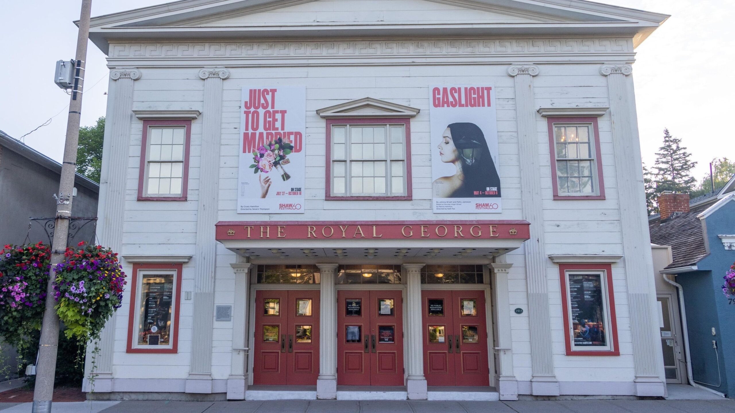 Theatre painted white with red doors.