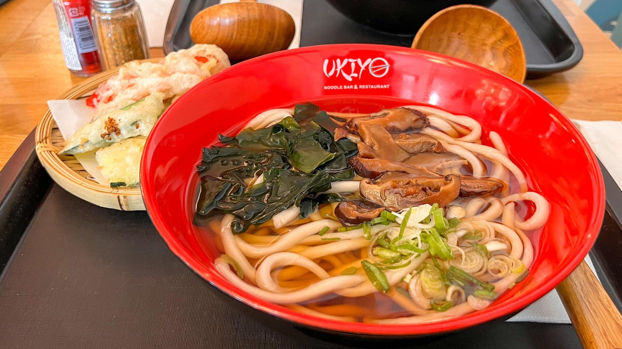 Mushroom ramen in red bowl.