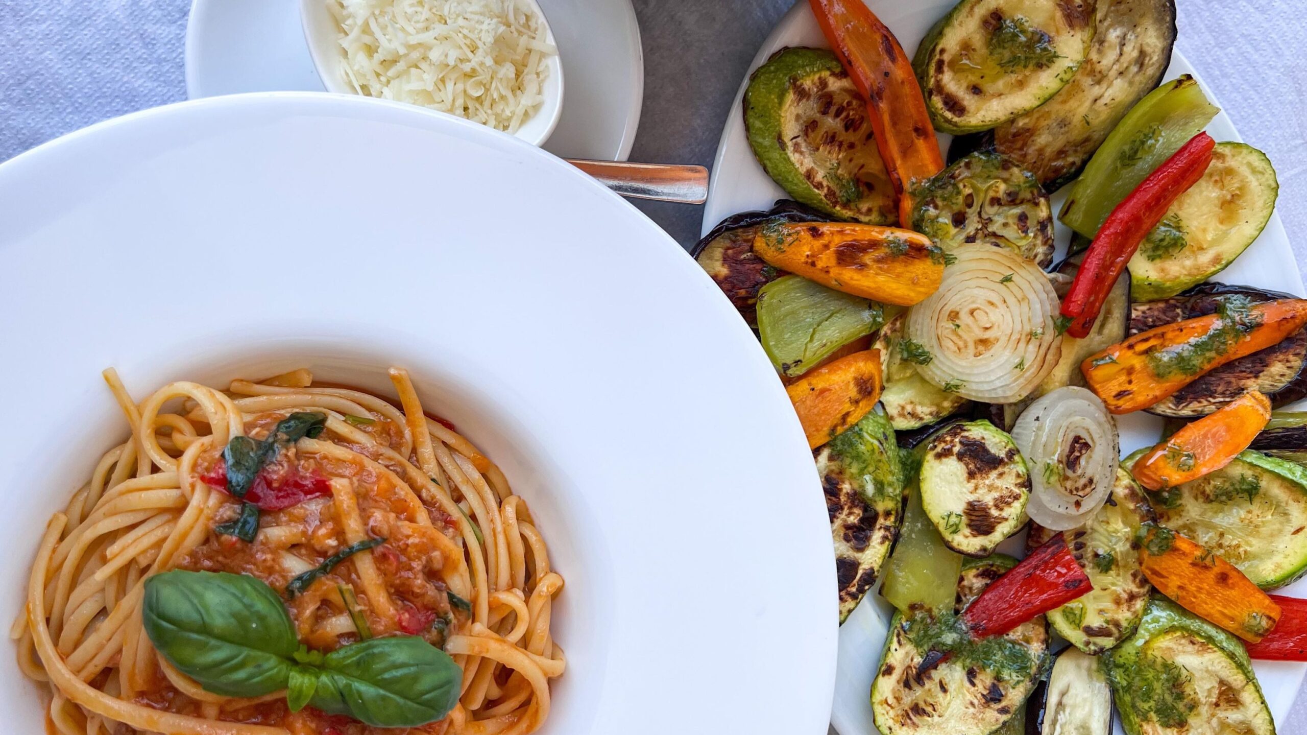 Grilled vegetables and spaghetti at restaurant. 