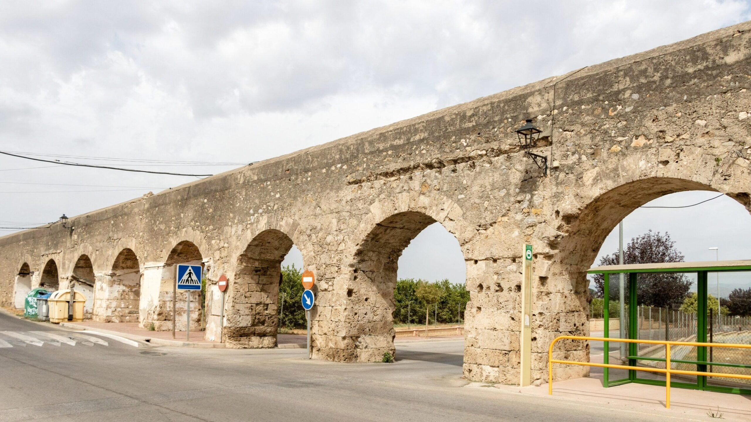 Stone Roman viaduct along back street in Malaga.