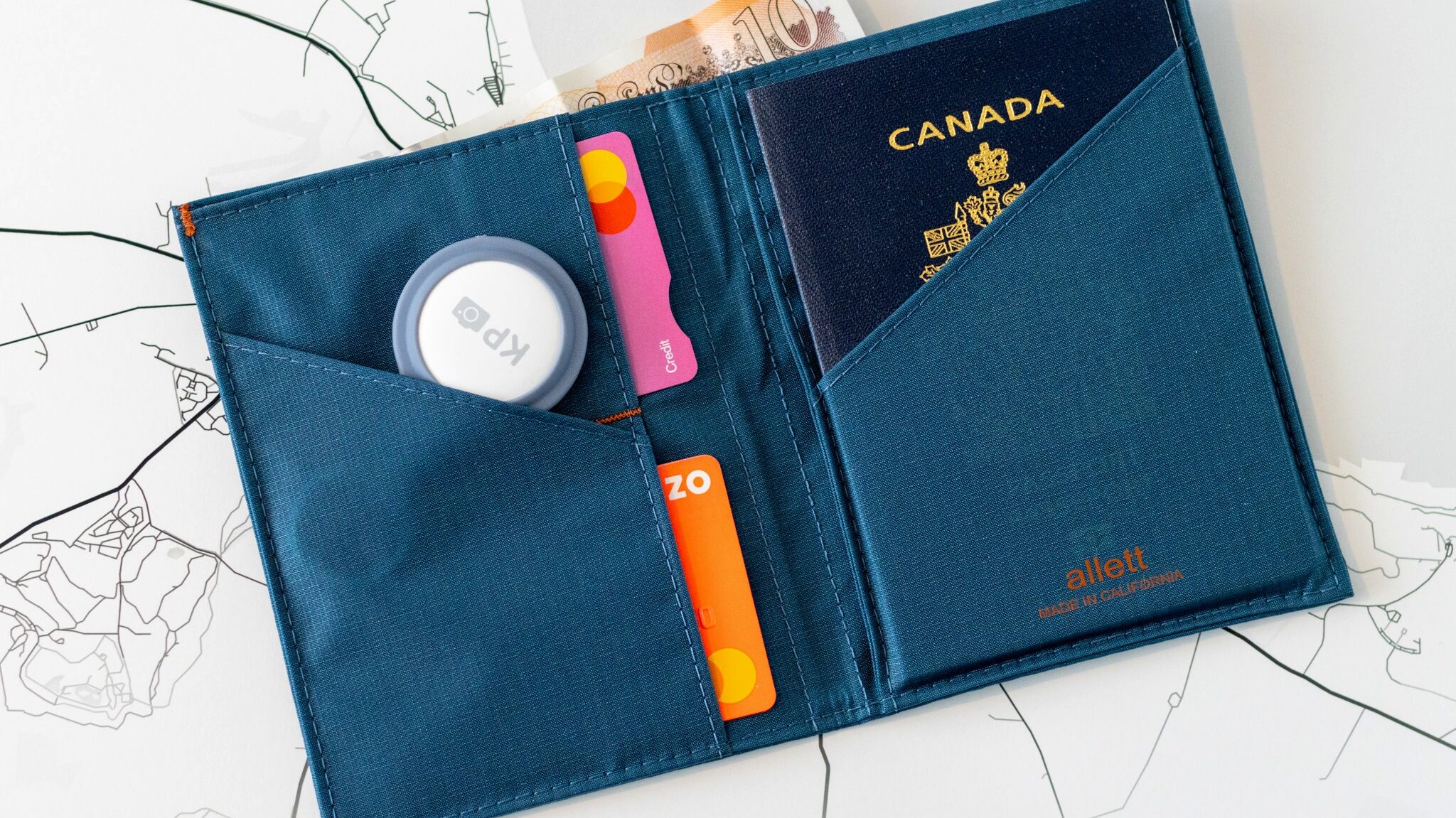 Blue passport wallet with credit cards.