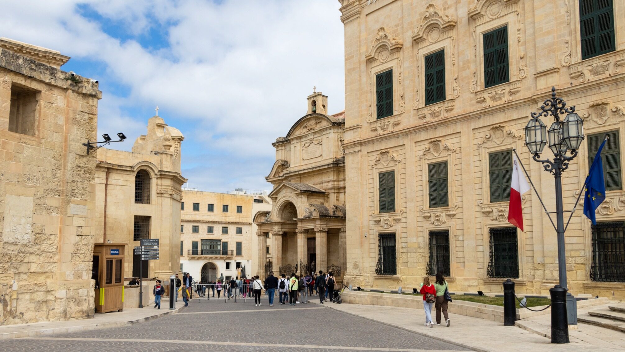 Small square with historic buildings.