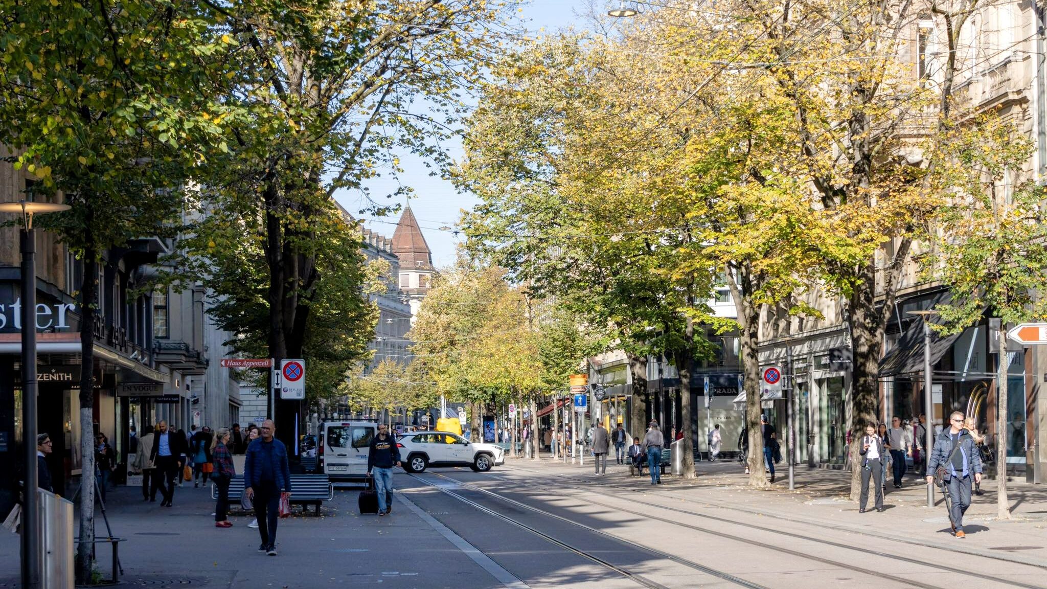 Shopping street in Zurich with tram line.