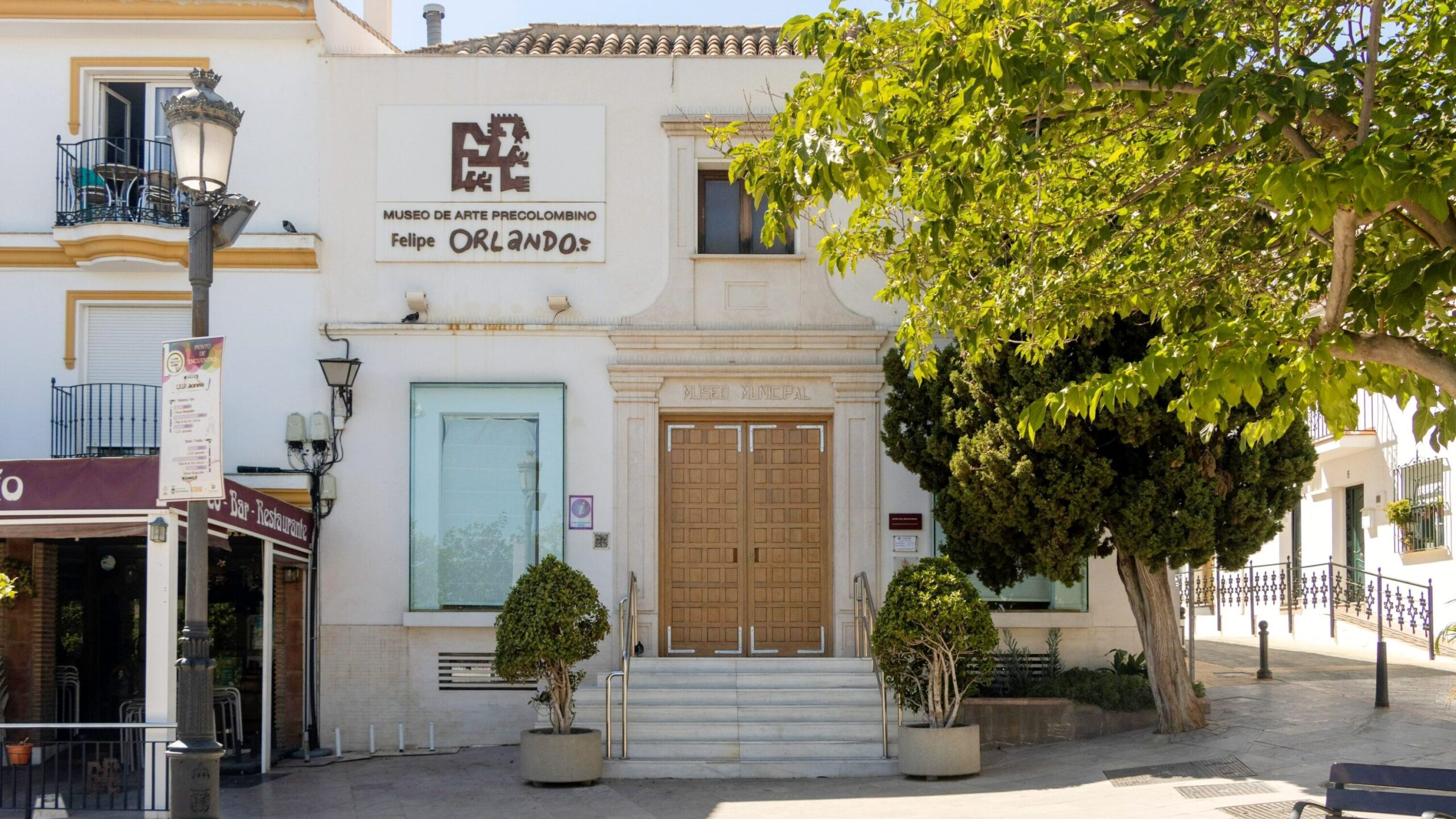 Entrance to history museum in white village.