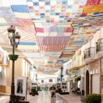 Street in village with crochet covering.