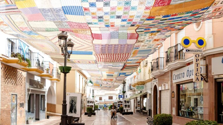 Street in village with crochet covering.