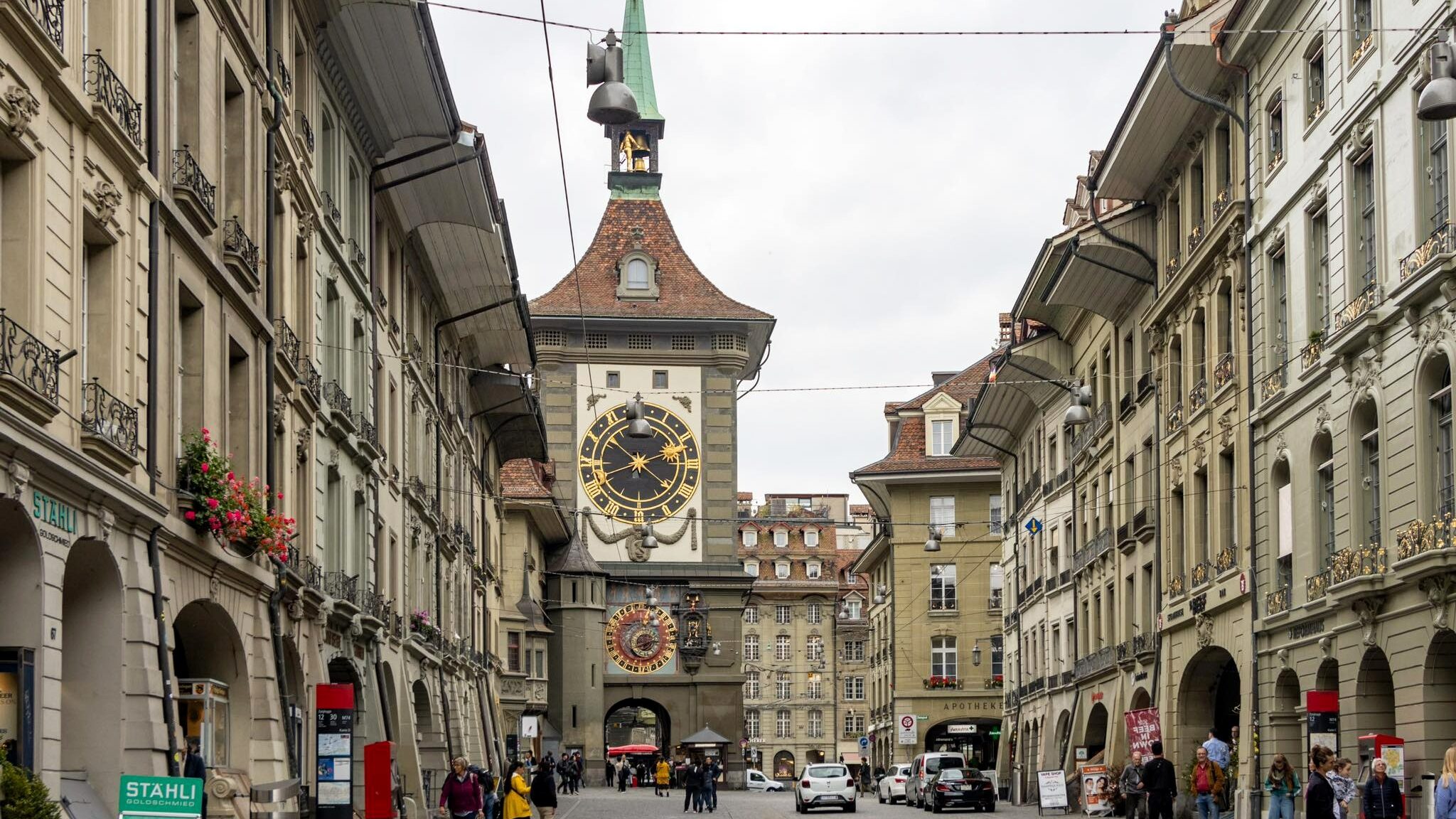 Medieval clock tower at the end of a street.