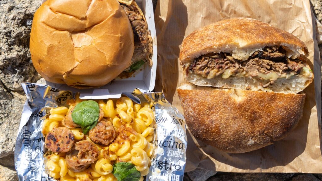 Two sandwiches with pulled pork and loaded macaroni cheese.