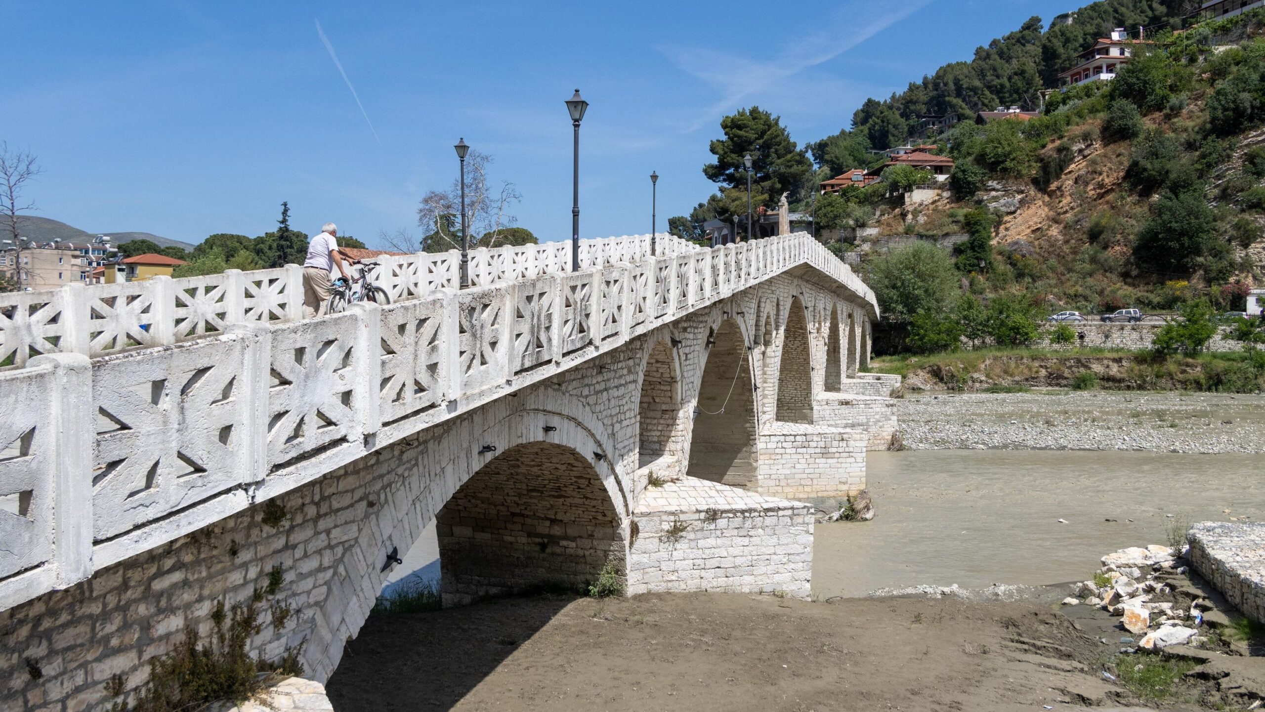 Historic bridge crossing river in Berat.