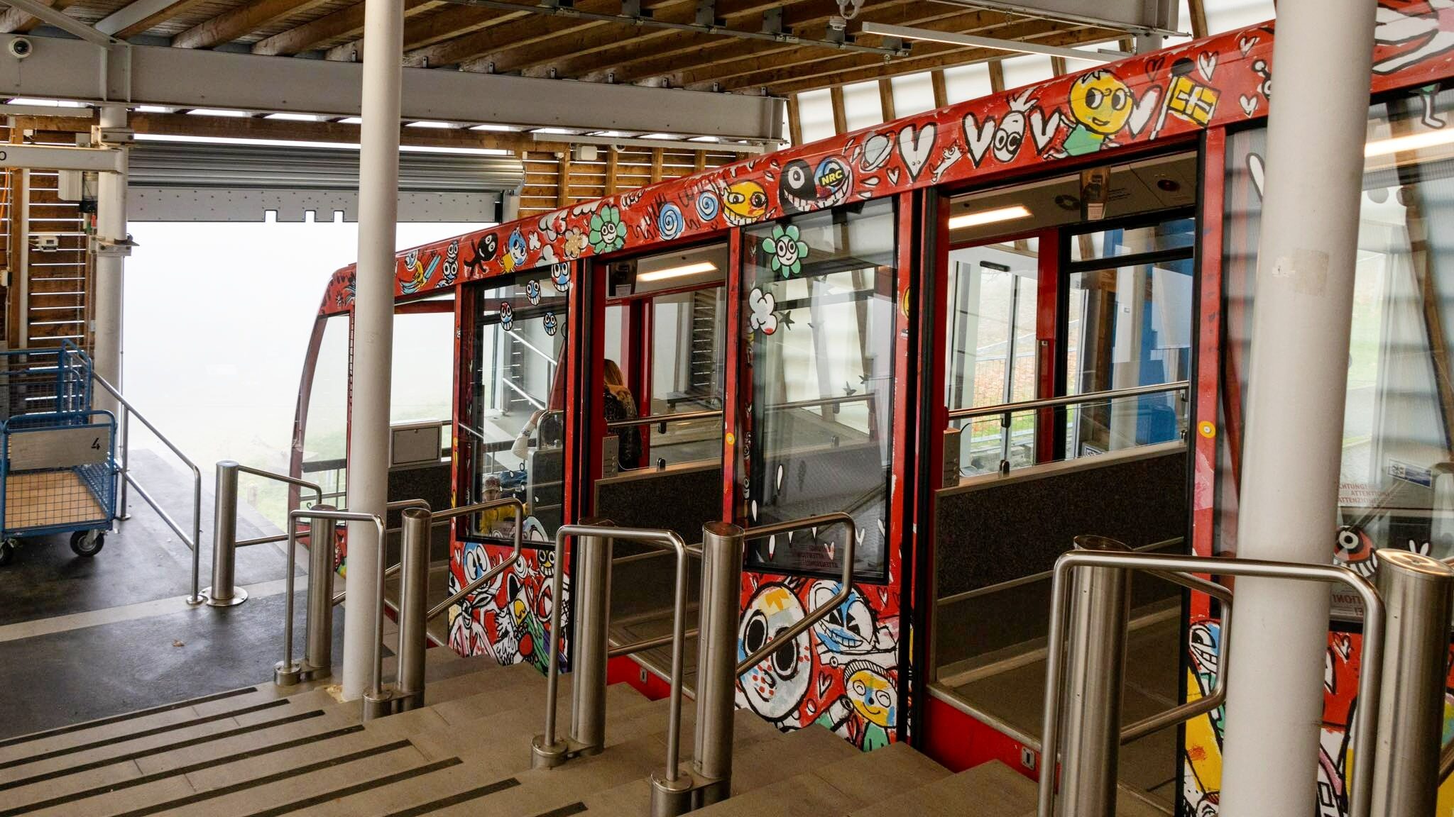 Red tram at the top of mountain in Bern.