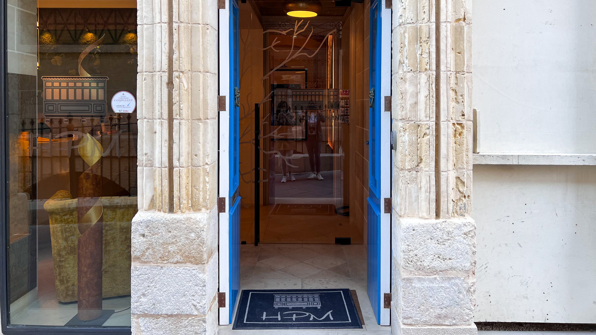 Blue door entrance to hotel in Valletta.