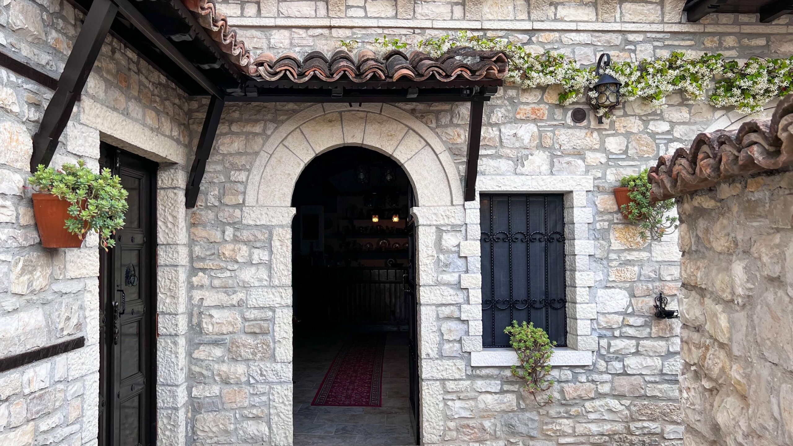 Door to hotel in stone wall.