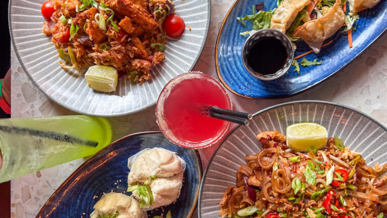 Selection of Asian food on restaurant table.