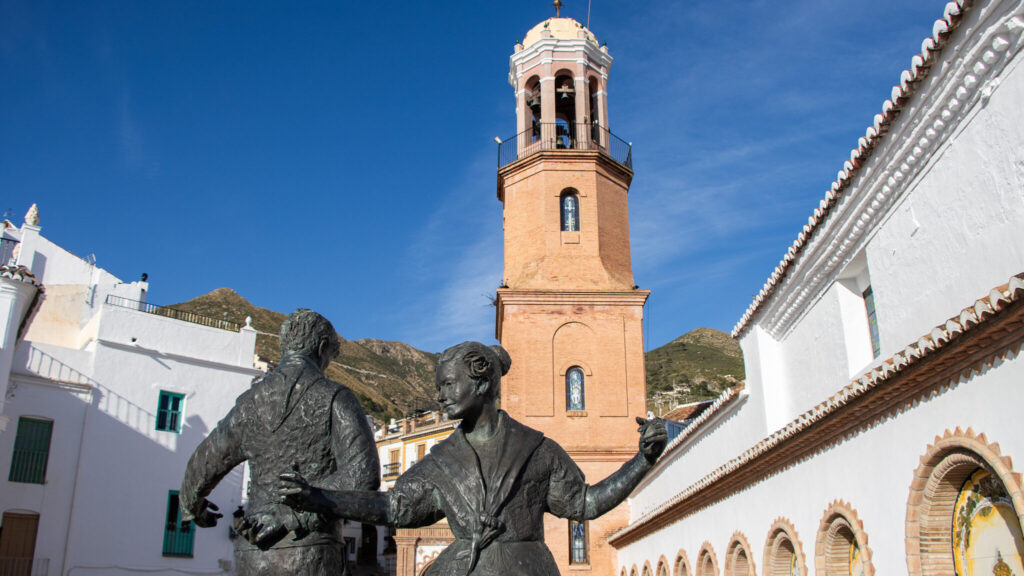 Church with statues dancing things to do in Competa.