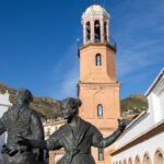 Church with statues dancing things to do in Competa.