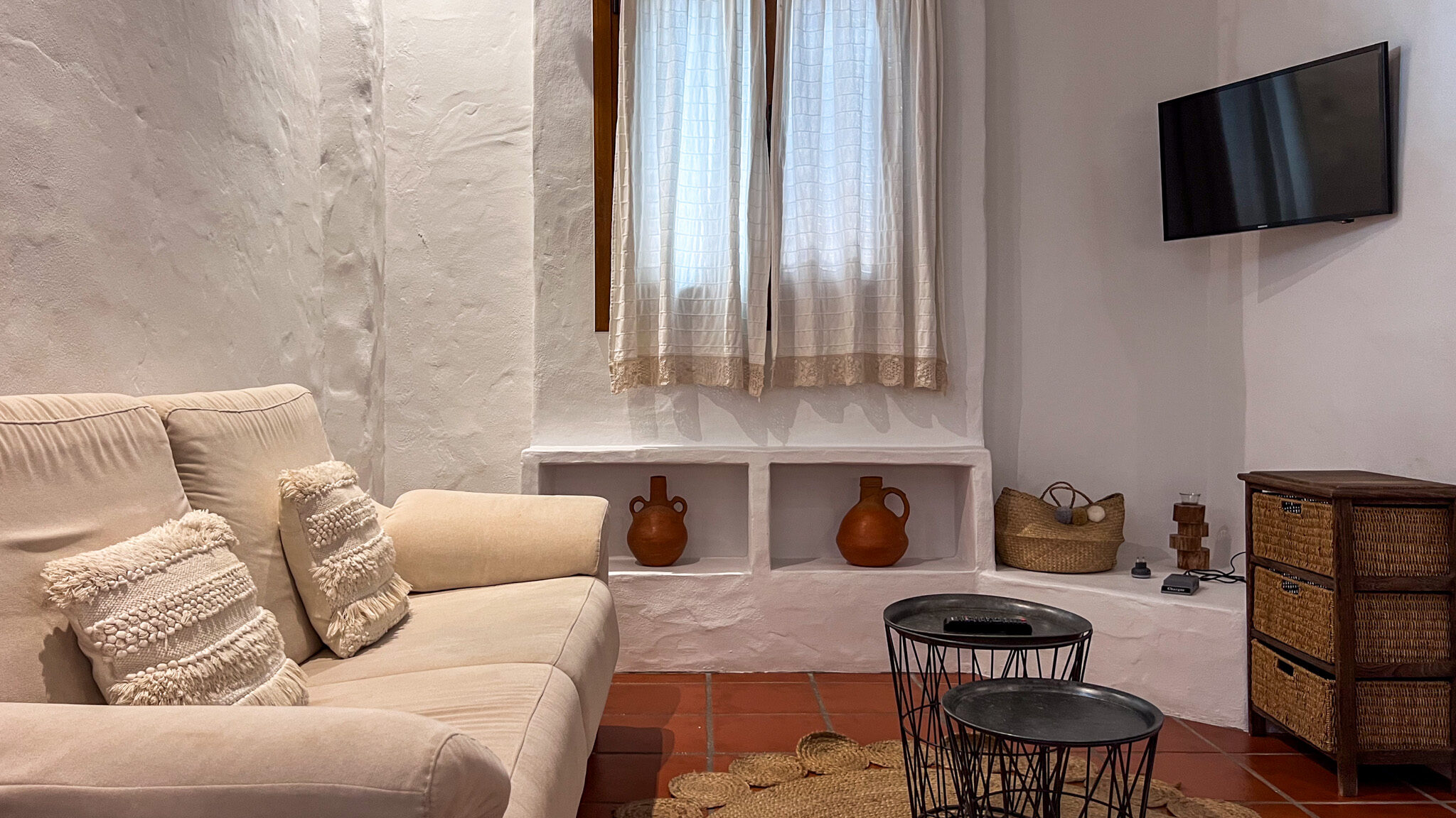 Seating area inside traditional beach house.