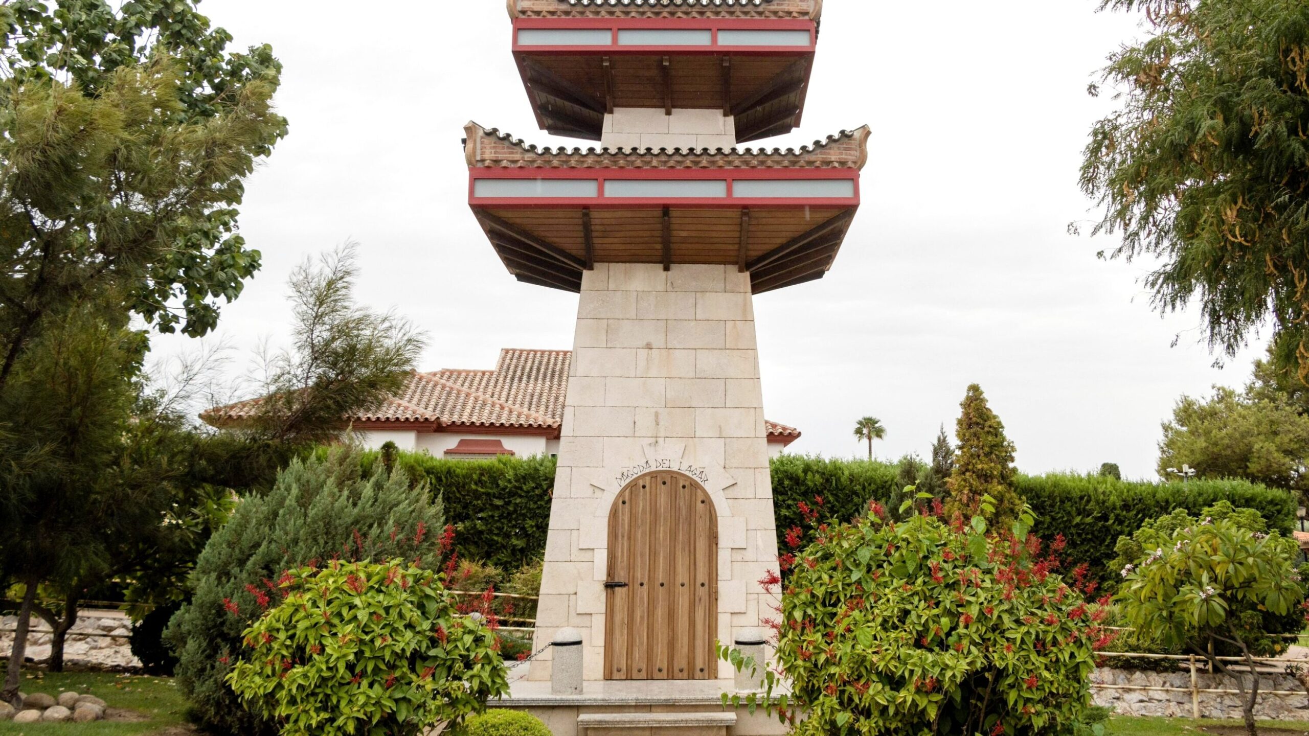 Small Japanese tower in garden.