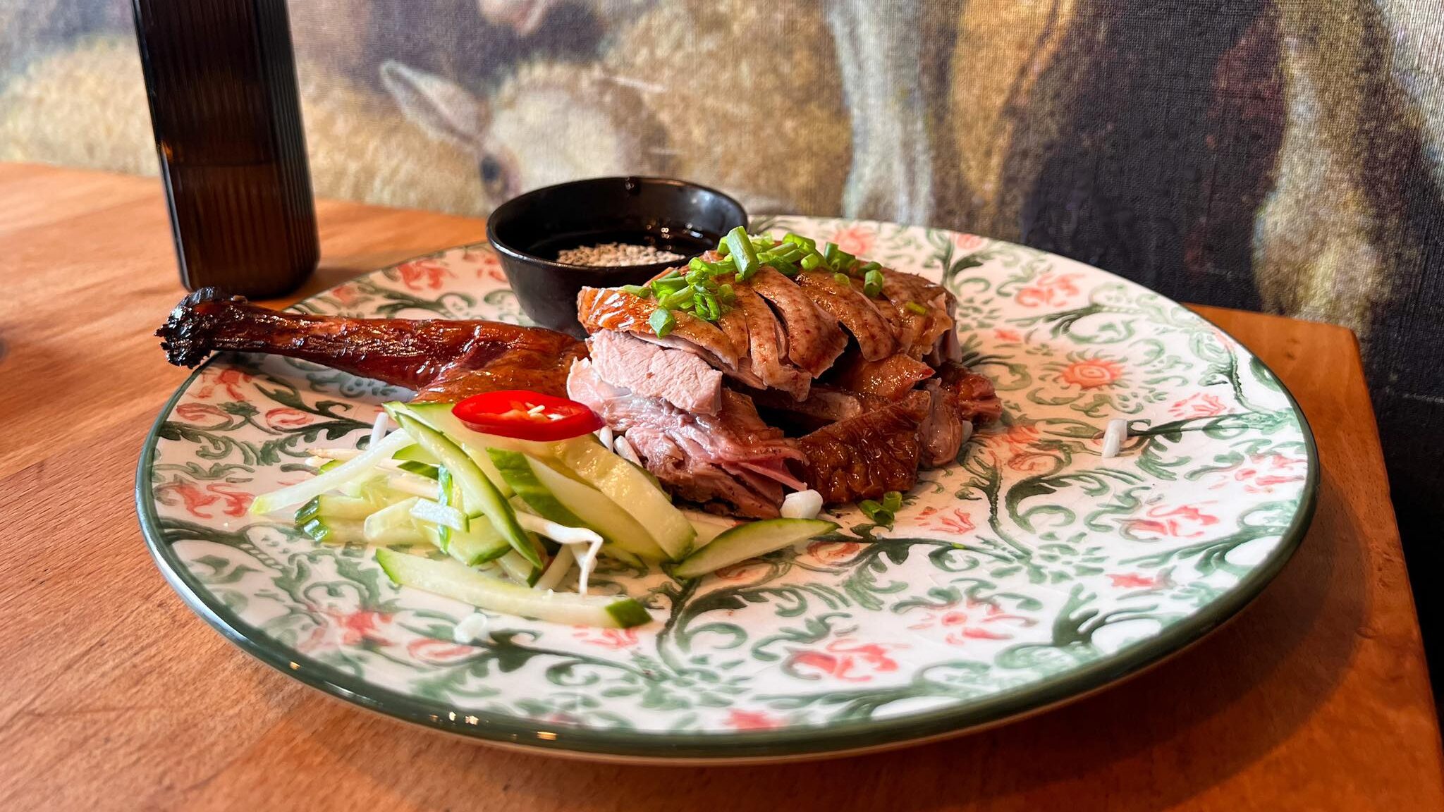 Roasted duck with side of vegetables.