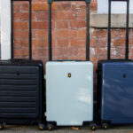 Three carry-on cases against wall LEVEL8 luggage review.