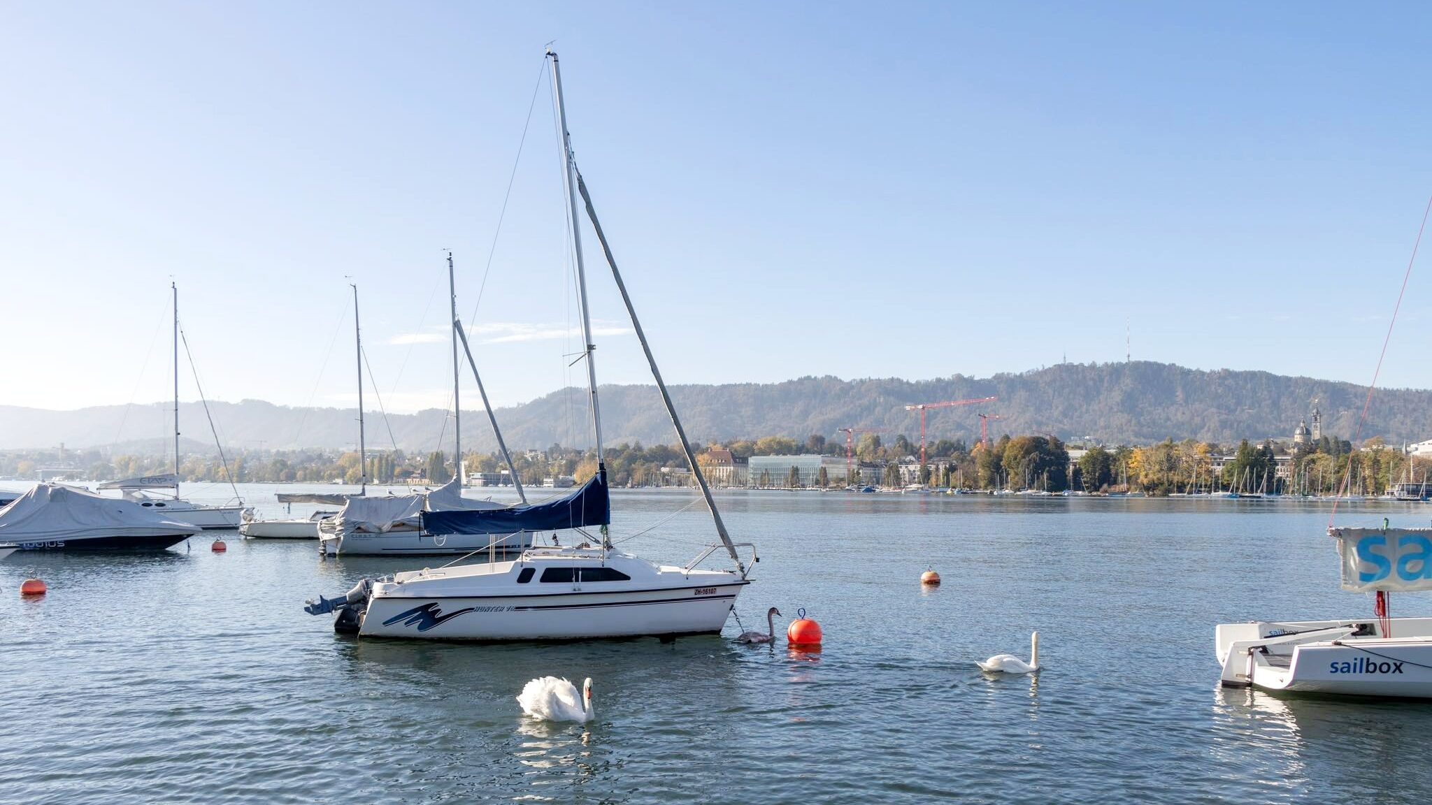 Lake in Zurich with boats docked.