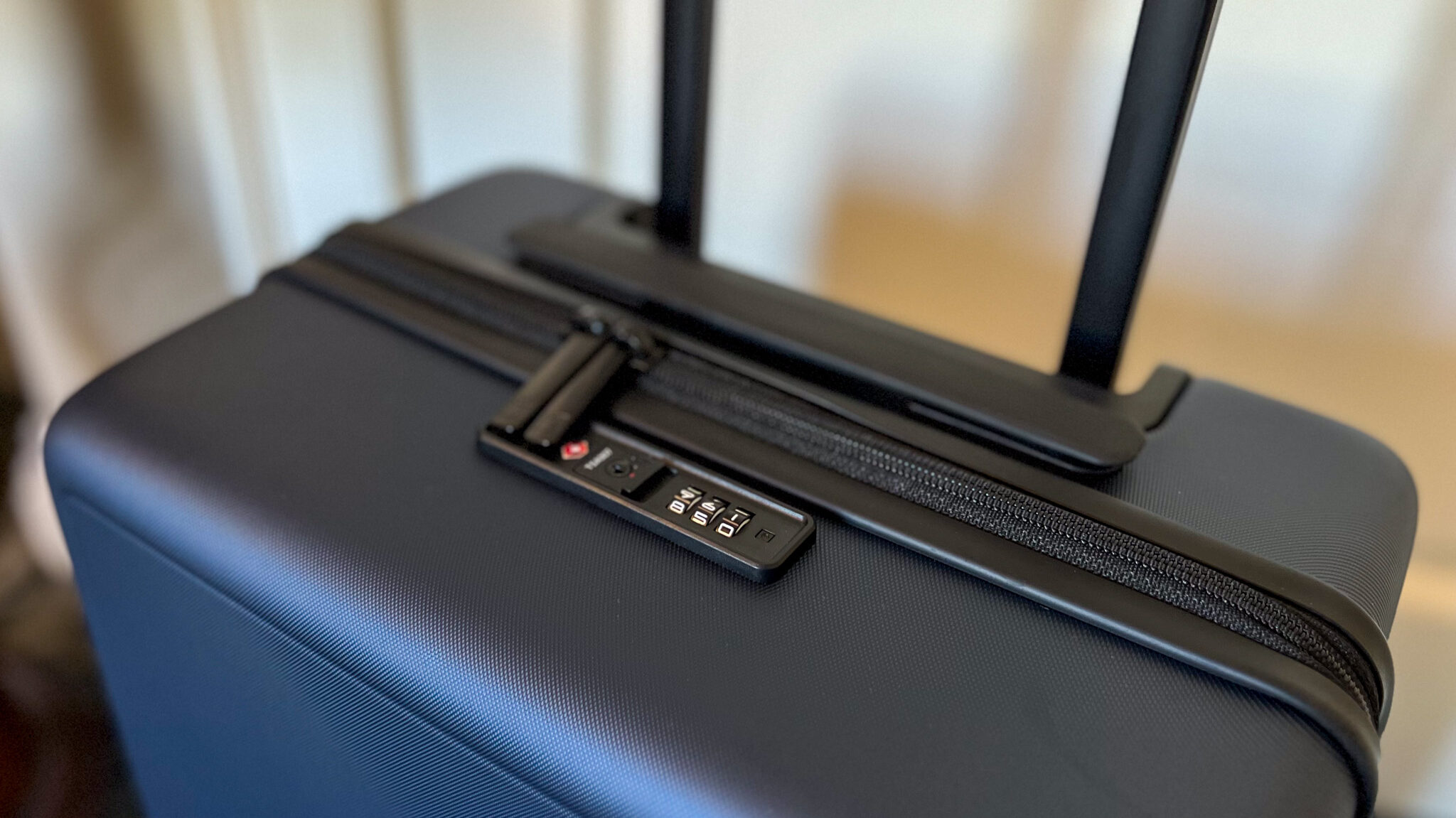 Top of suitcase with secure lock.