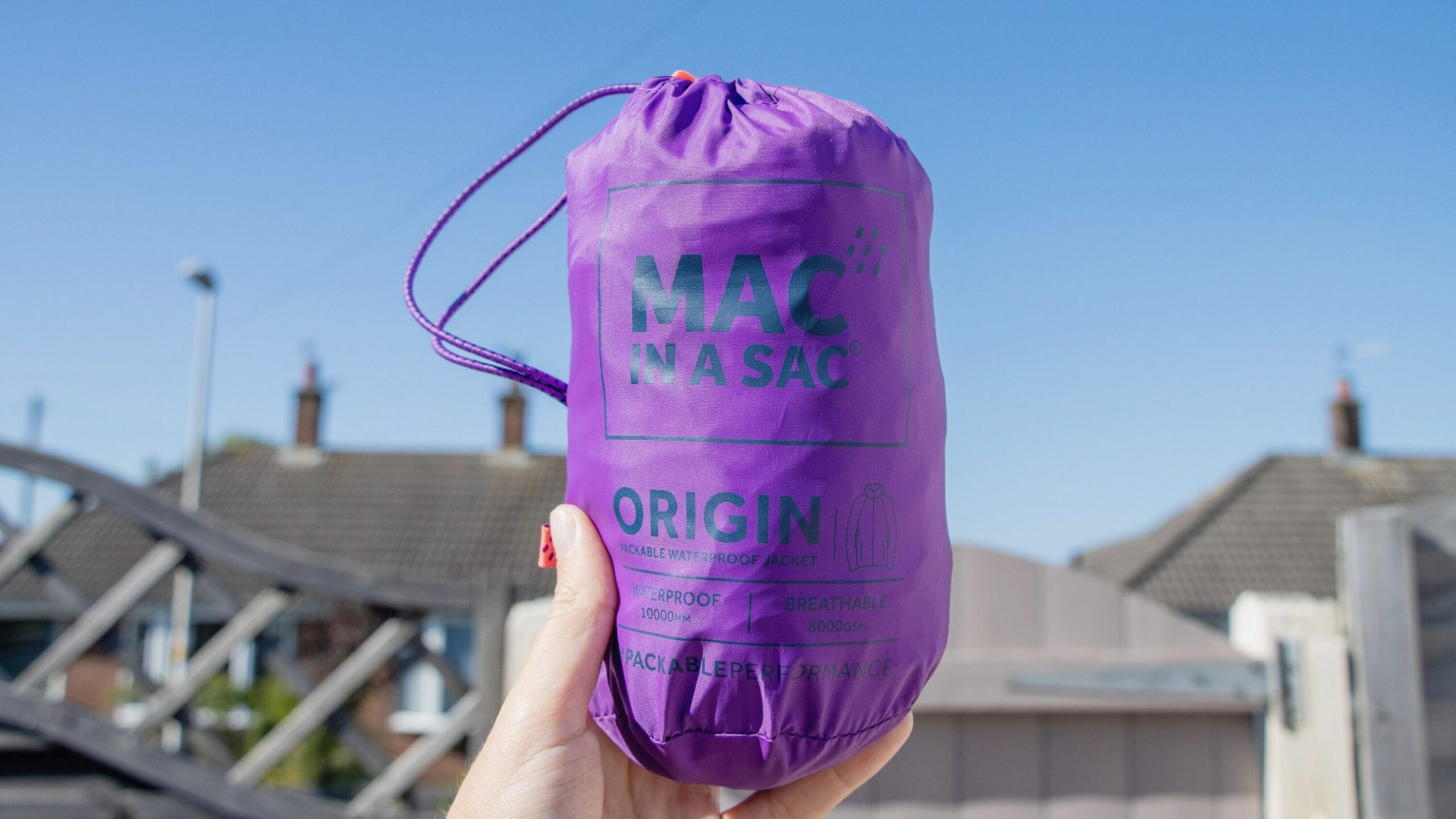 Purple mac folded up in bag.