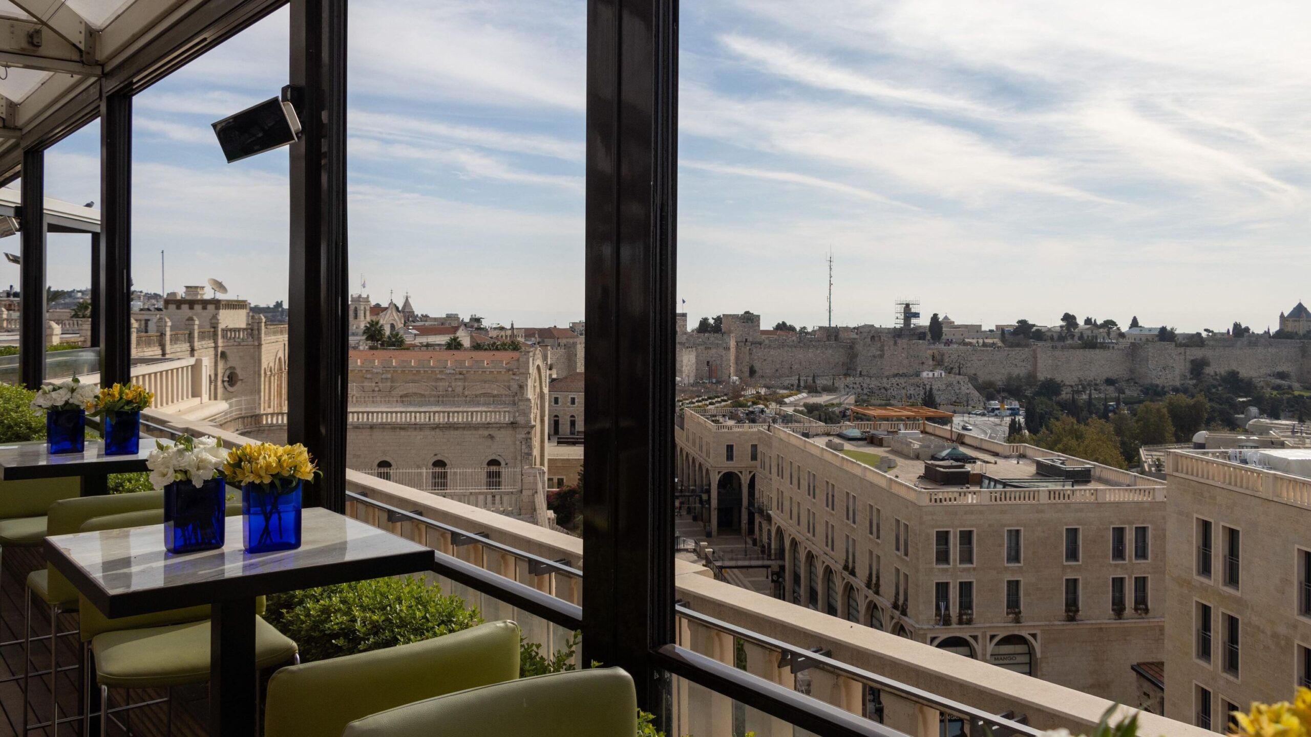 View of Old City from a rooftop hotel bar in Jerusalem. 